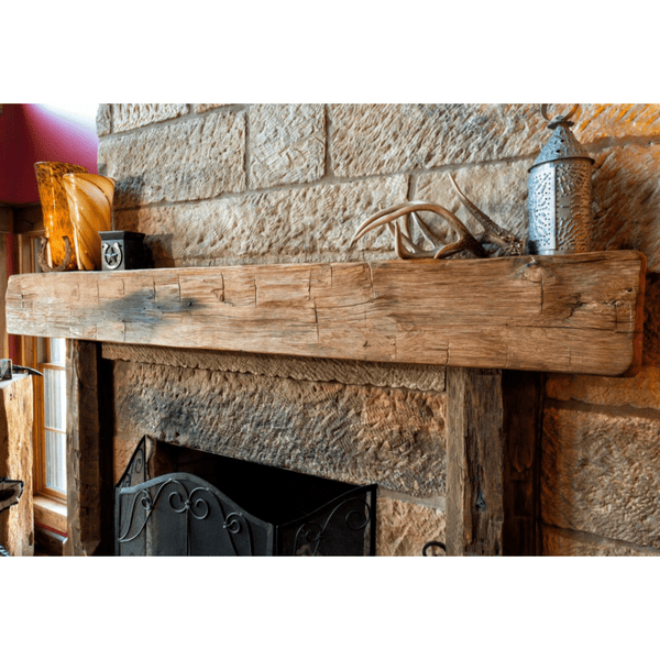 olde wood hand hewn wooden fireplace mantel in living area