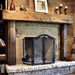 olde wood hand hewn wooden fireplace mantel indoors in living room