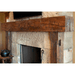 olde wood hand hewn wooden fireplace mantel on brick wall with tudor brown finish