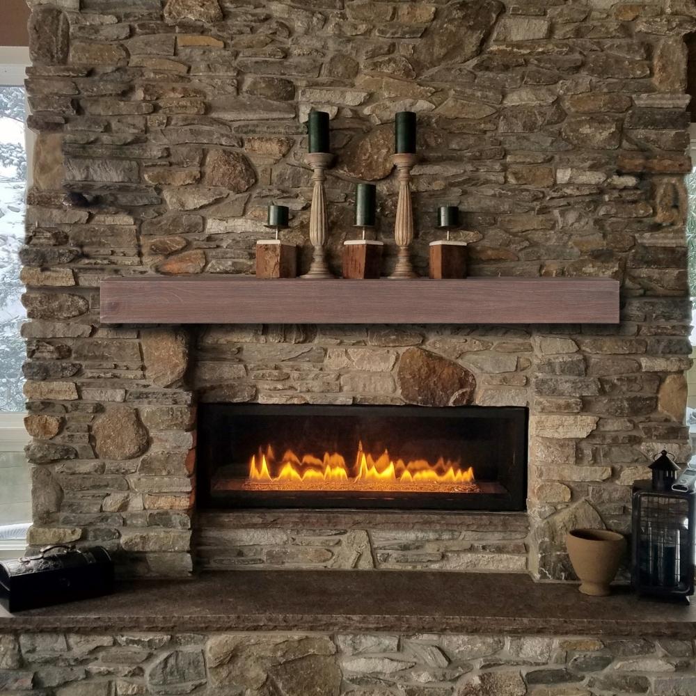 Pearl Mantels Carolina Wood Mantel Shelf With Decorations Installed on a Stone Finished Wall