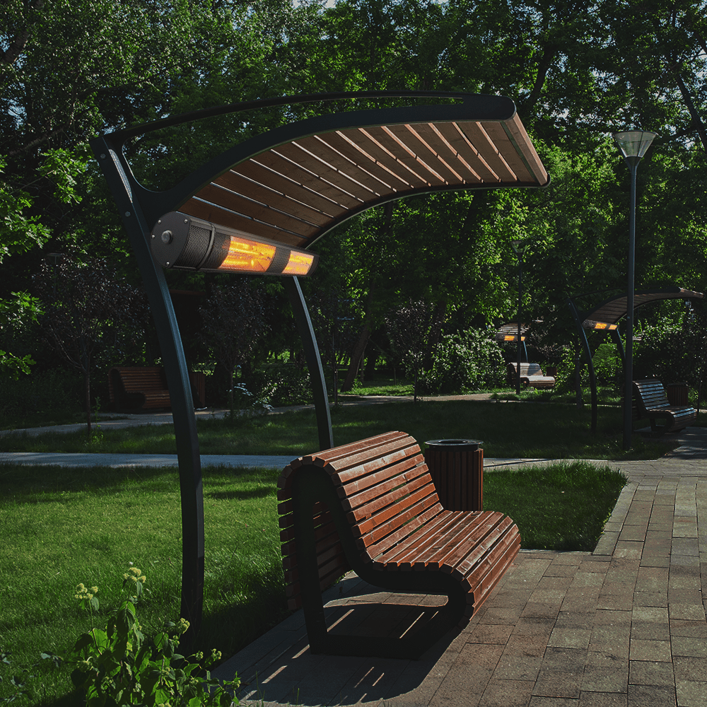 RADtec Genesis 38-Inch Infrared Electric Heater mounted above the bench in a park