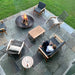cozy patio set up with seasons fire pits concave fire pit in the center