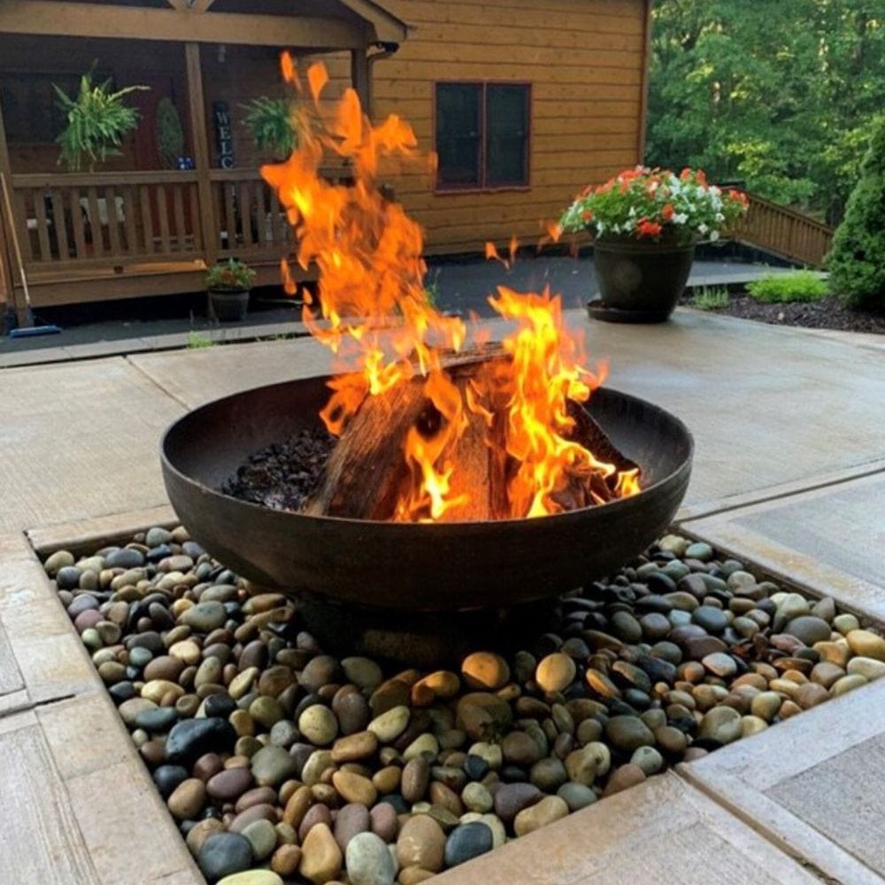 seasons fire pits elliptical round fire pit placed on top of rocks