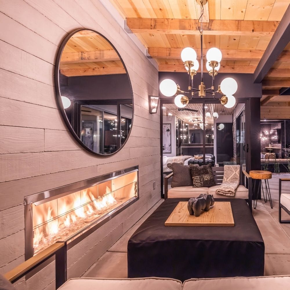 Superior Linear Vent-Free Outdoor Gas Fireplace Below Mirror in Outdoor Patio