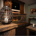 The Bio Flame 60-Inch Firebox SS Built-in Ethanol Fireplace in a rustic cabin setting