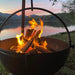 cowboy cauldron fire pit grill with wood near the lake