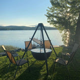 black fire pit grill by cowboy cauldron at the backyard