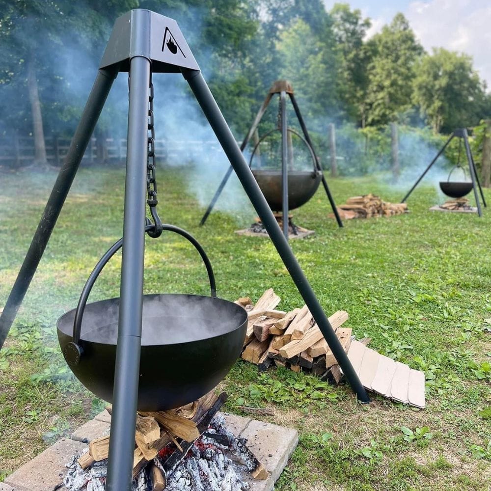 Outdoor Fire Pit With Coffee Pots And Cast Iron Cauldron Stock