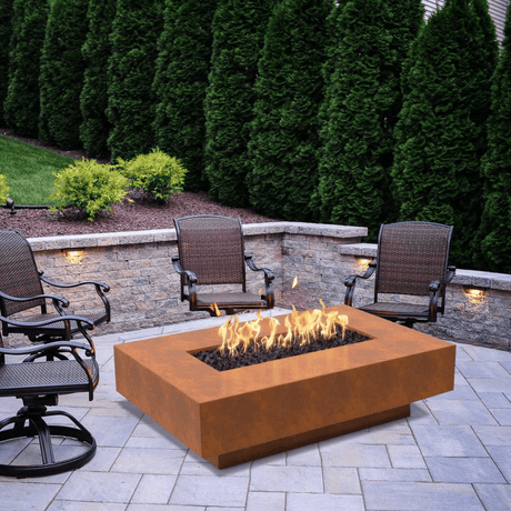 Top Fires Cabo Linear Corten Steel Gas Fire Pit Table in a beautiful garden