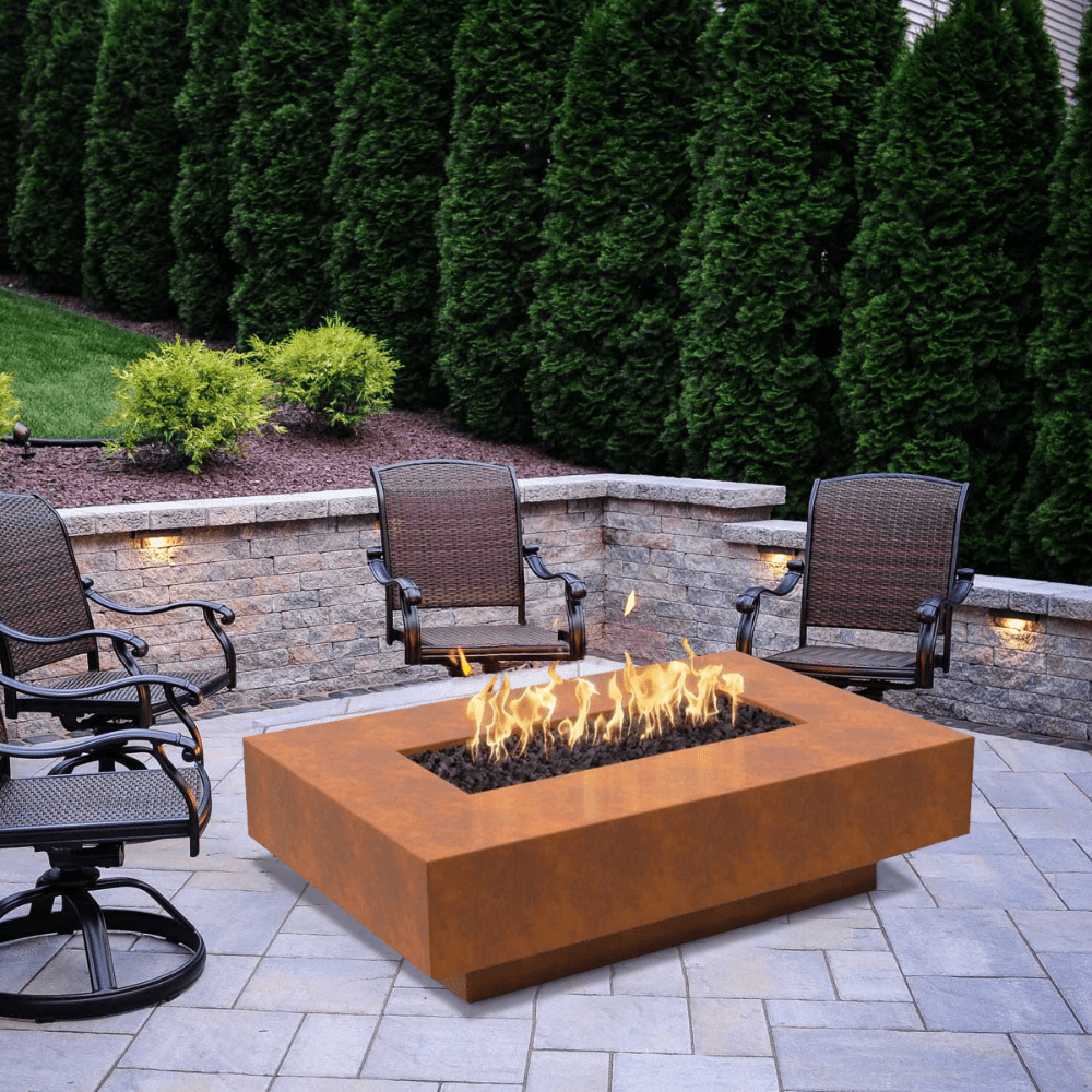 Top Fires Cabo Linear Corten Steel Gas Fire Pit Table in a beautiful garden