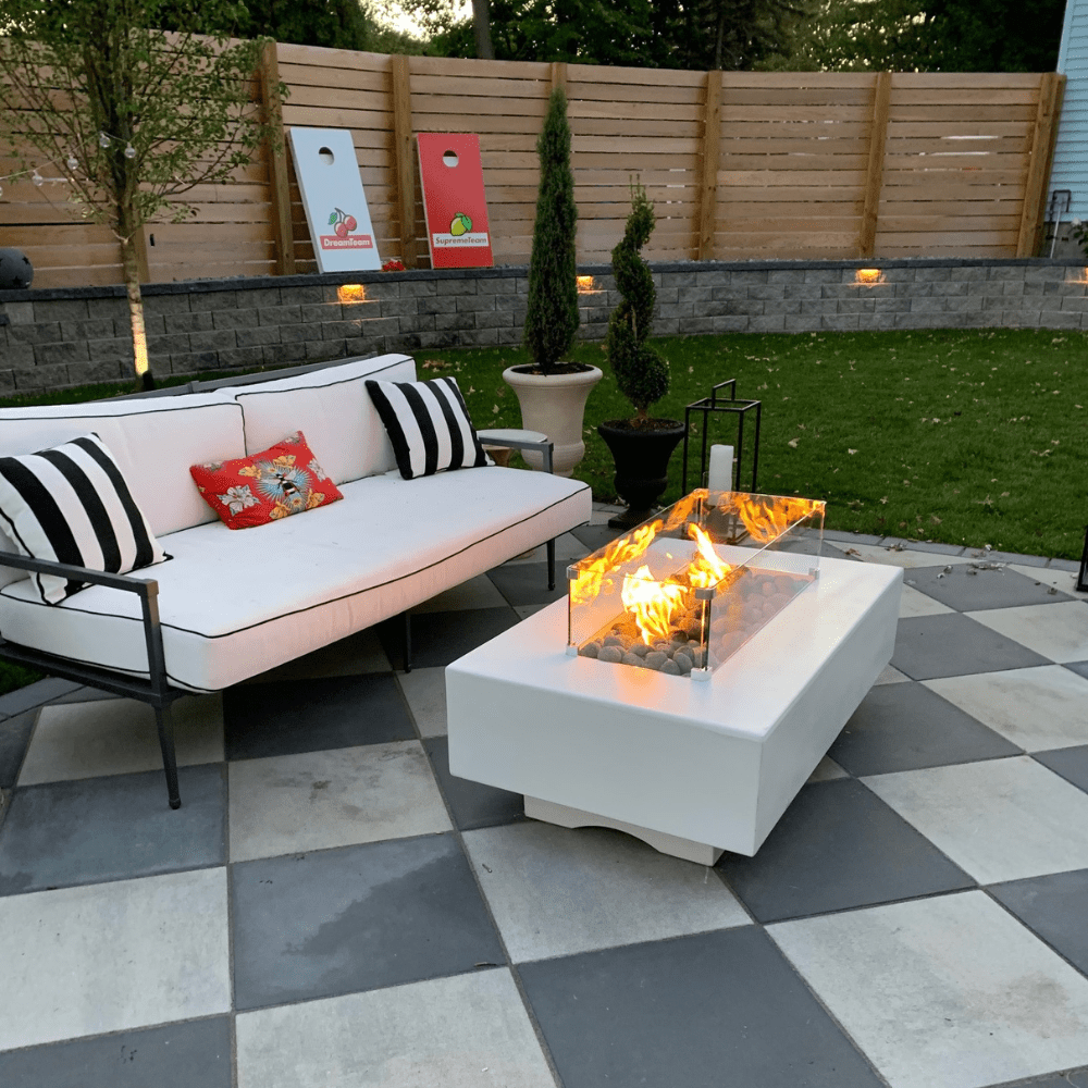 Top Fires Del Mar GFRC Gas Fire Pit White with Wind Guard at Backyard