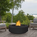 Black Round Fire Pit in Patio with Chairs and Trees