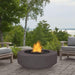 Chestnut Round Fire Pit in Patio with Chairs and Trees