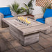 Top Fires Grove 60" Rectangular GFRC Fire Table in outdoor living area
