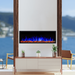 touchstone sideline elite outdoor fireplace with blue flames in beautiful outdoor setting
