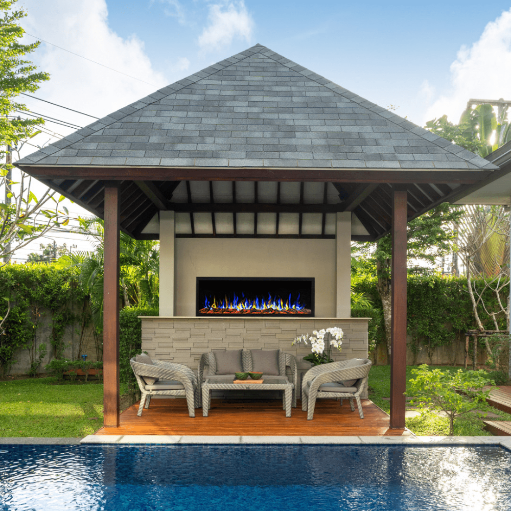 touchstone sideline elite outdoor fireplace in a modern pergola with multicolored flames