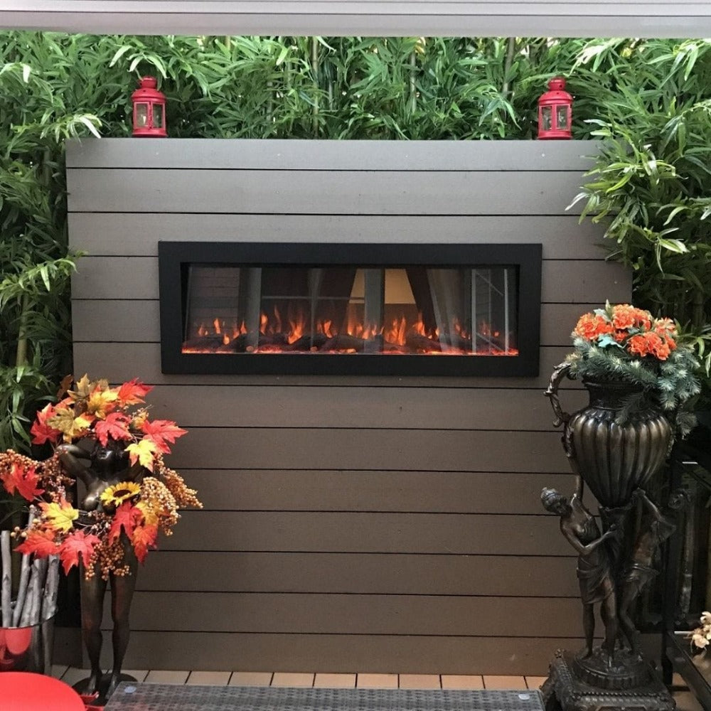 Touchstone Sideline Outdoor 50-Inch Recessed / Wall Mounted Electric Fireplace, No Heat (#80017) in Garden setting