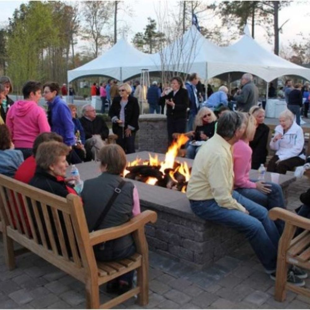 warming trends stone fire pit in a community gathering
