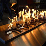 tall, bright flames of warming trends crossfire tree style gas burner