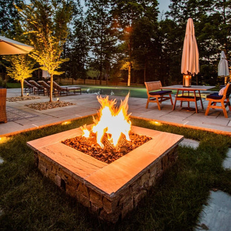 Custom Fire Pit with Lava Rocks and Ceramic Logs
