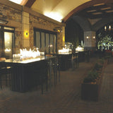 Warming Trends Linear CROSSFIRE™ Brass Burners in Outdoor Dining Area